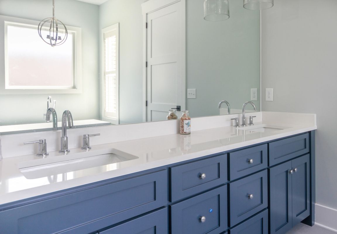 sink painted blue with large mirro
