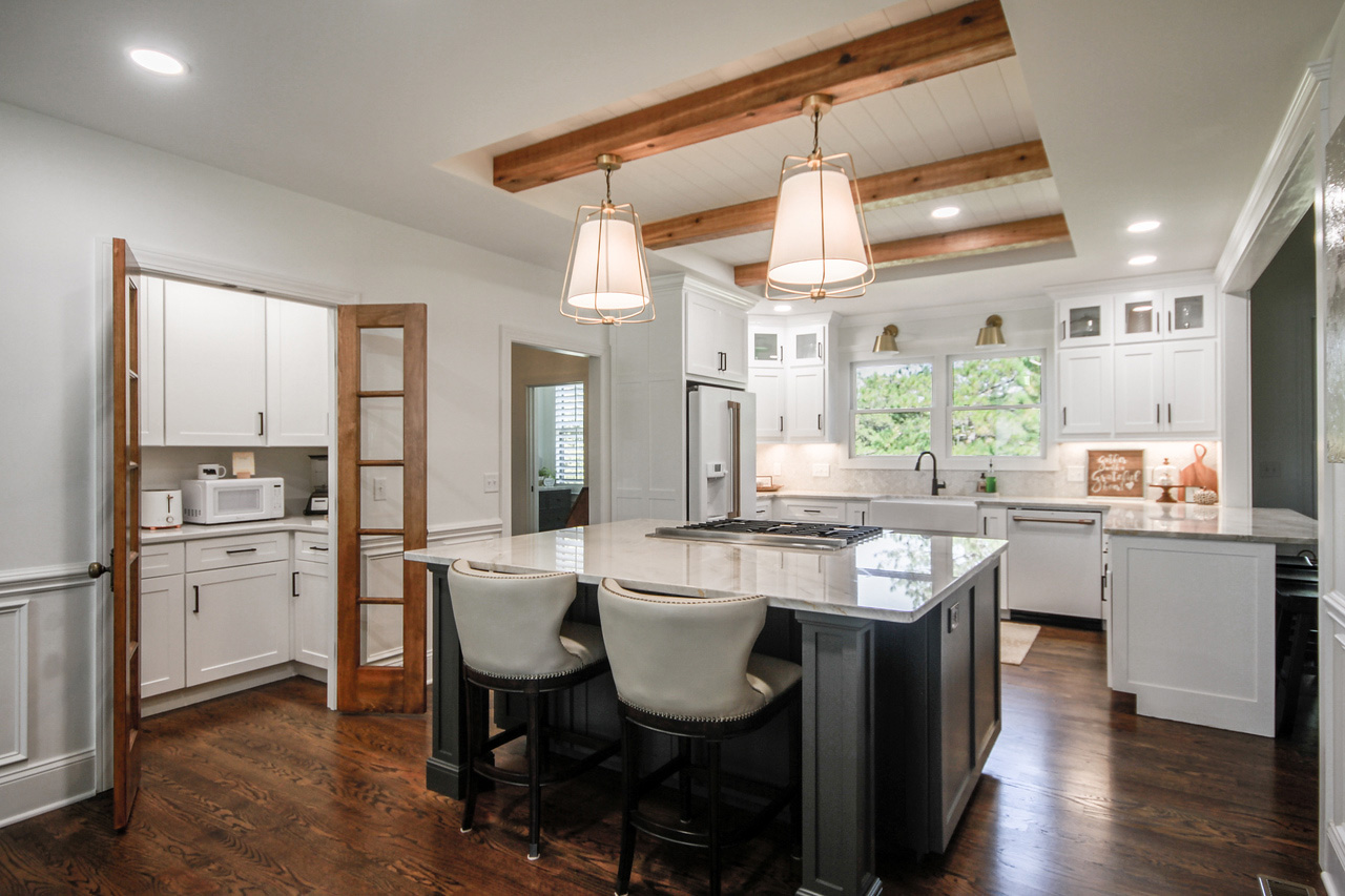 Caba Homes Gallery - white and gray kitchen with wood accents