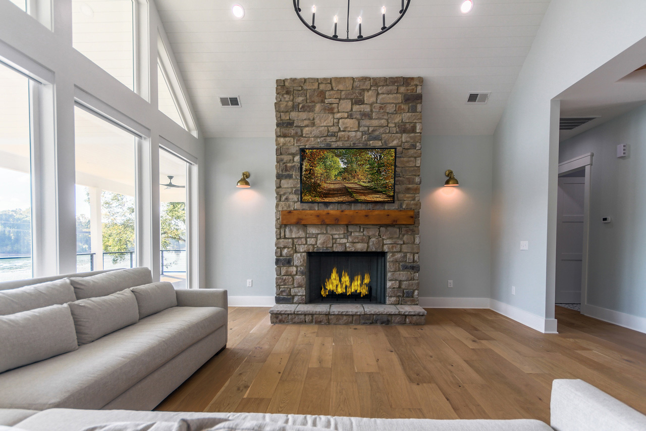 Caba Homes Gallery - tall stone fireplace in living room